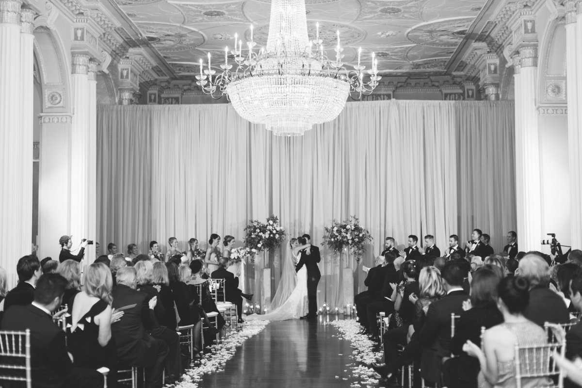 It's the first kiss after becoming husband and wife.  Real wedding moment captured by Rebecca Cerasani.