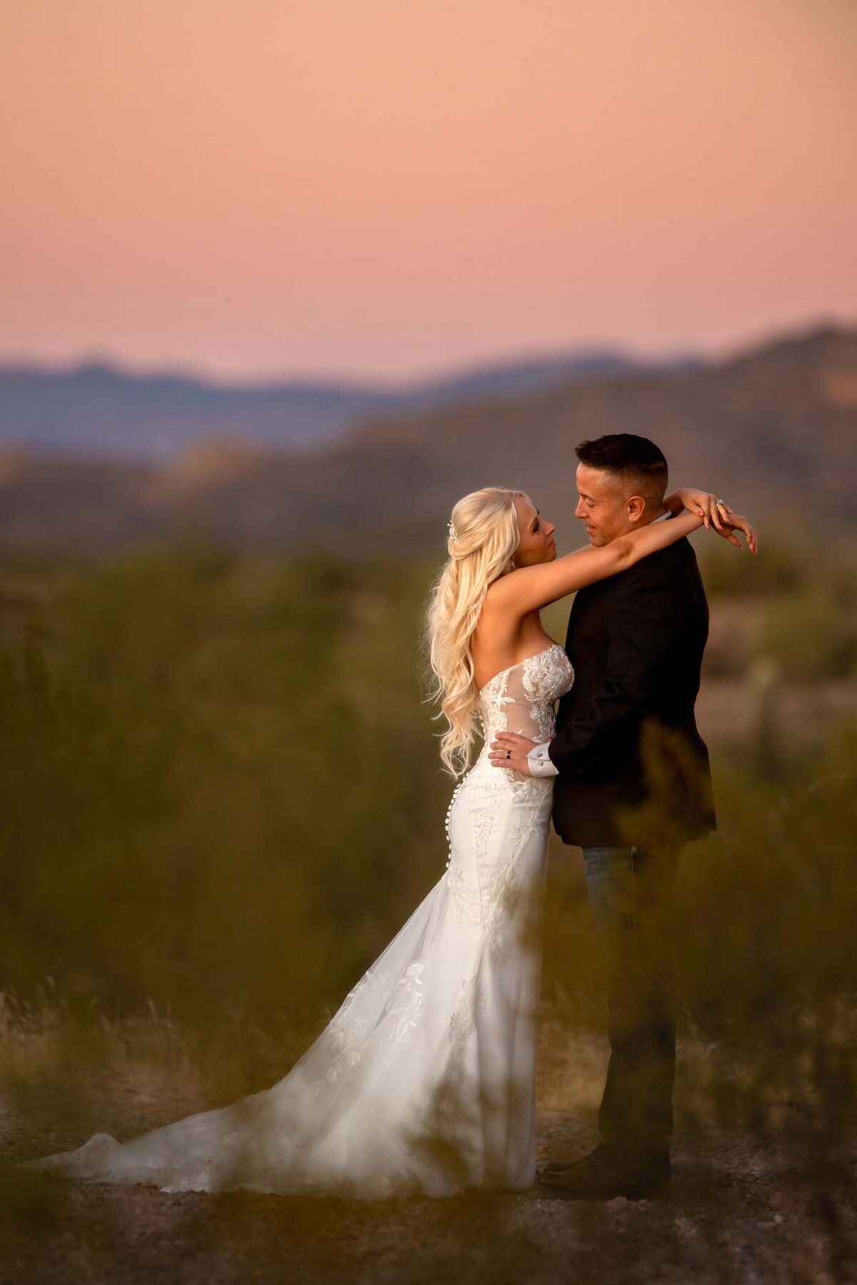 Intimate elopement sunset picture of groom and bride in Arizona