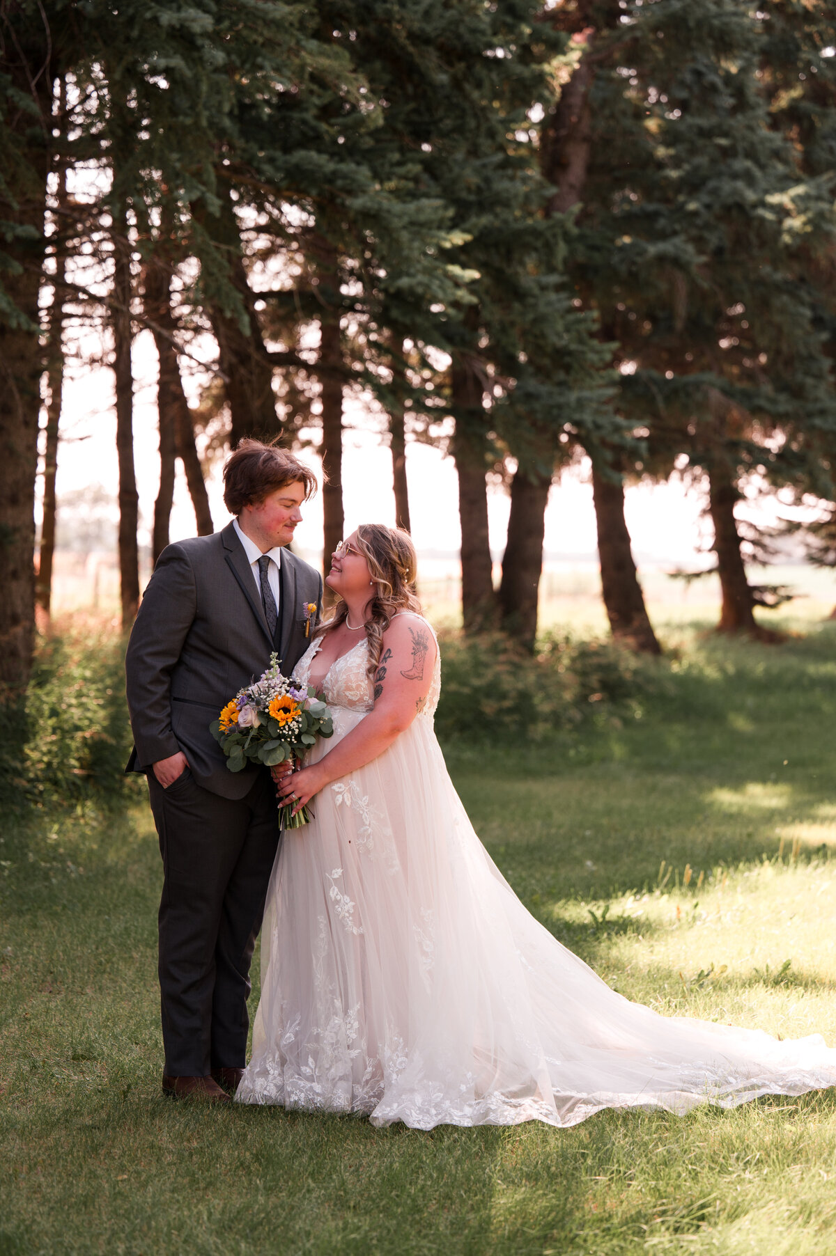 Summer wedding portrait of bride and groom at Falkenberg Stables