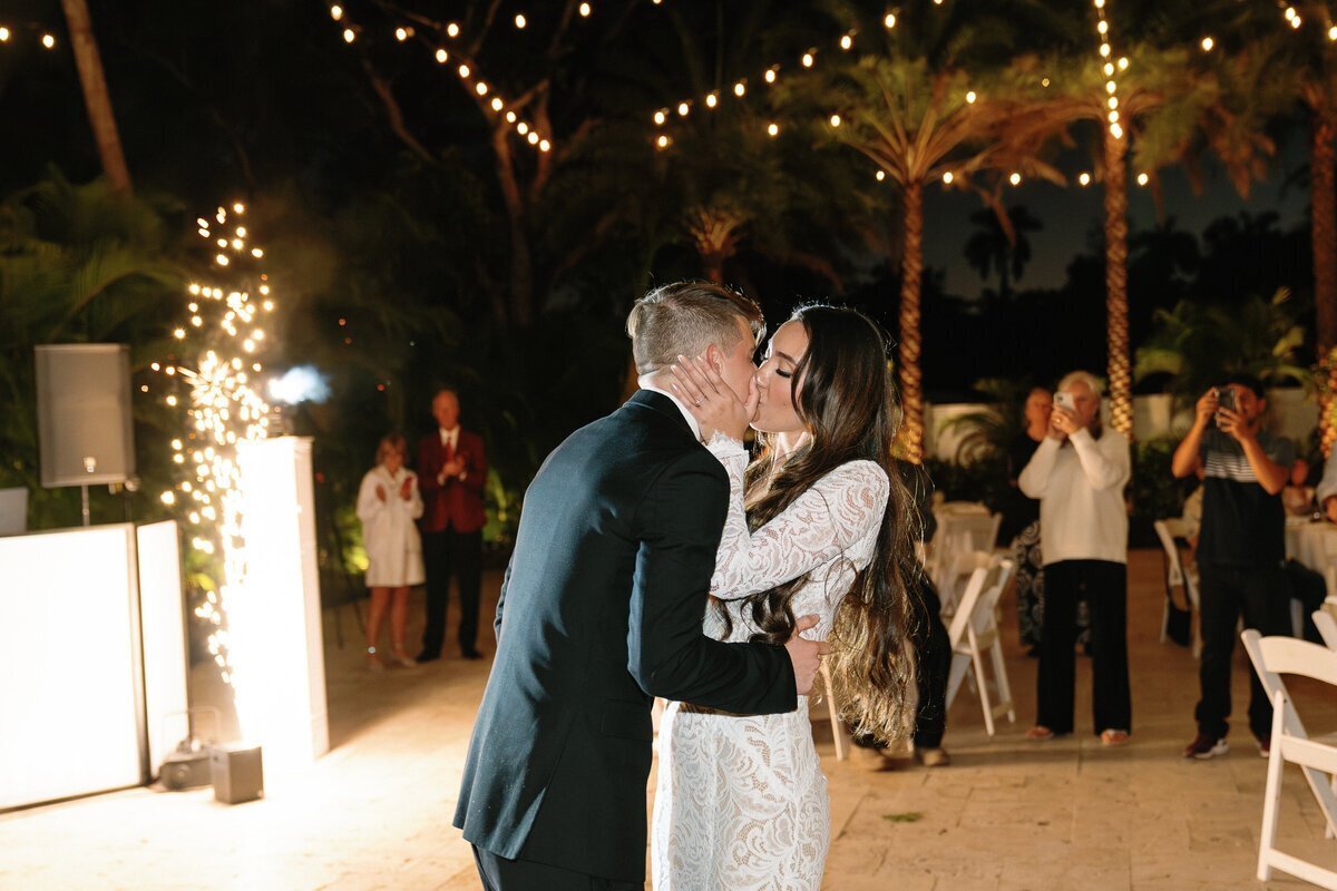 Bride and groom kissing at wedding, by film wedding photographers