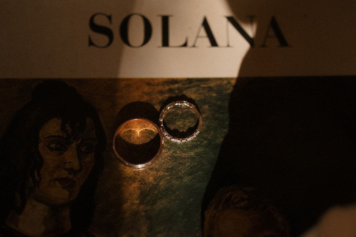 wedding-details-rings-on-book-cover-laurianevega