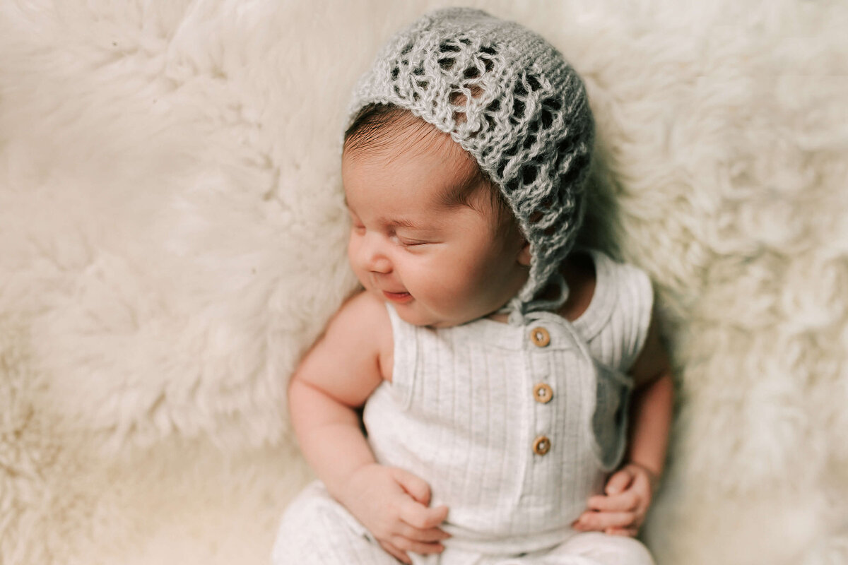 baby girl in grey crochet hat