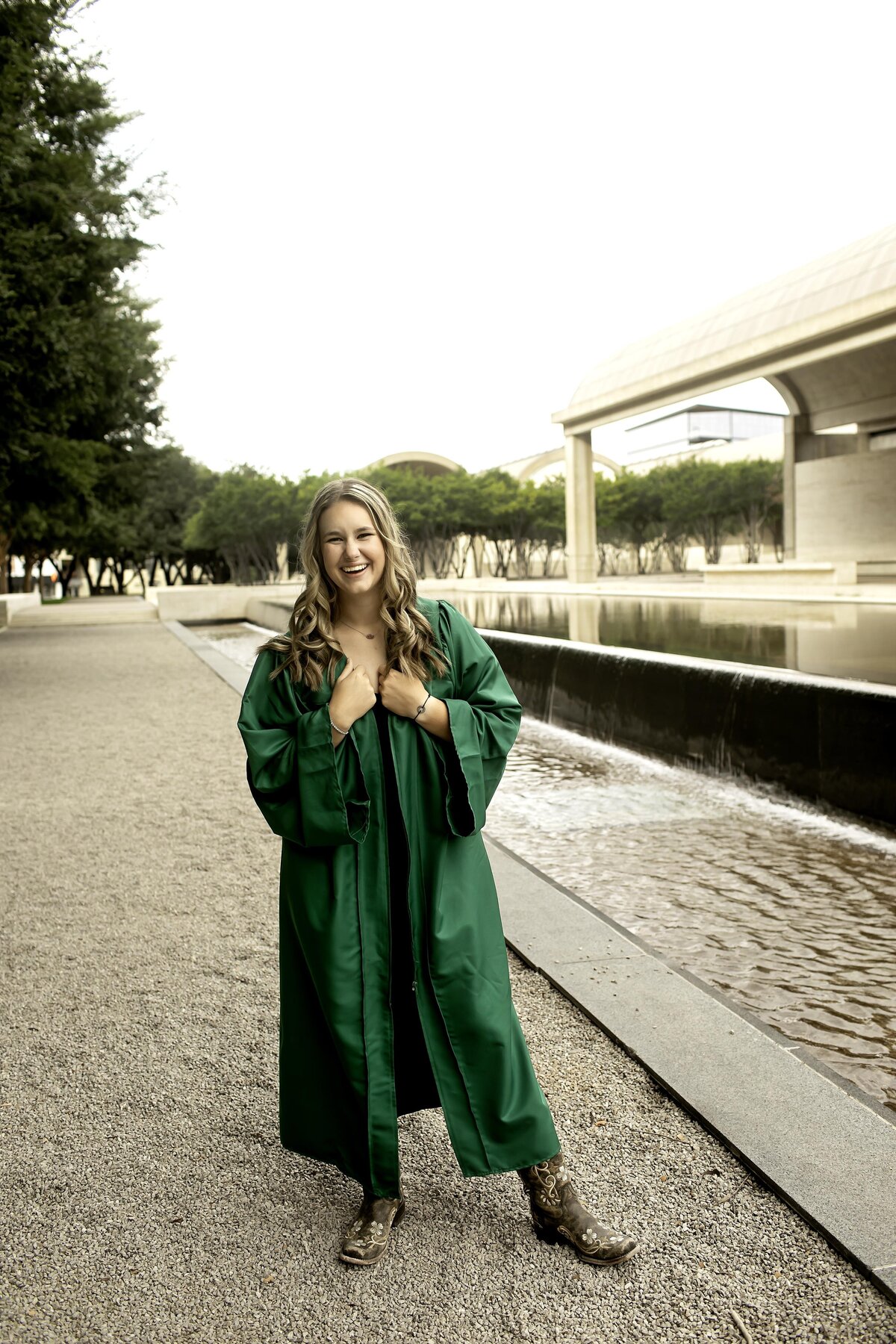 A joyful senior with a bright smile, showing off their cap and gown