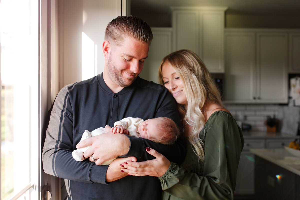 mom and dad with newborn baby boy