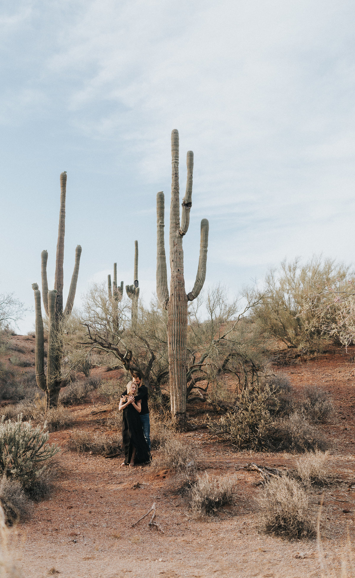 An in love couple during their adventure engagement session in Page Arizona