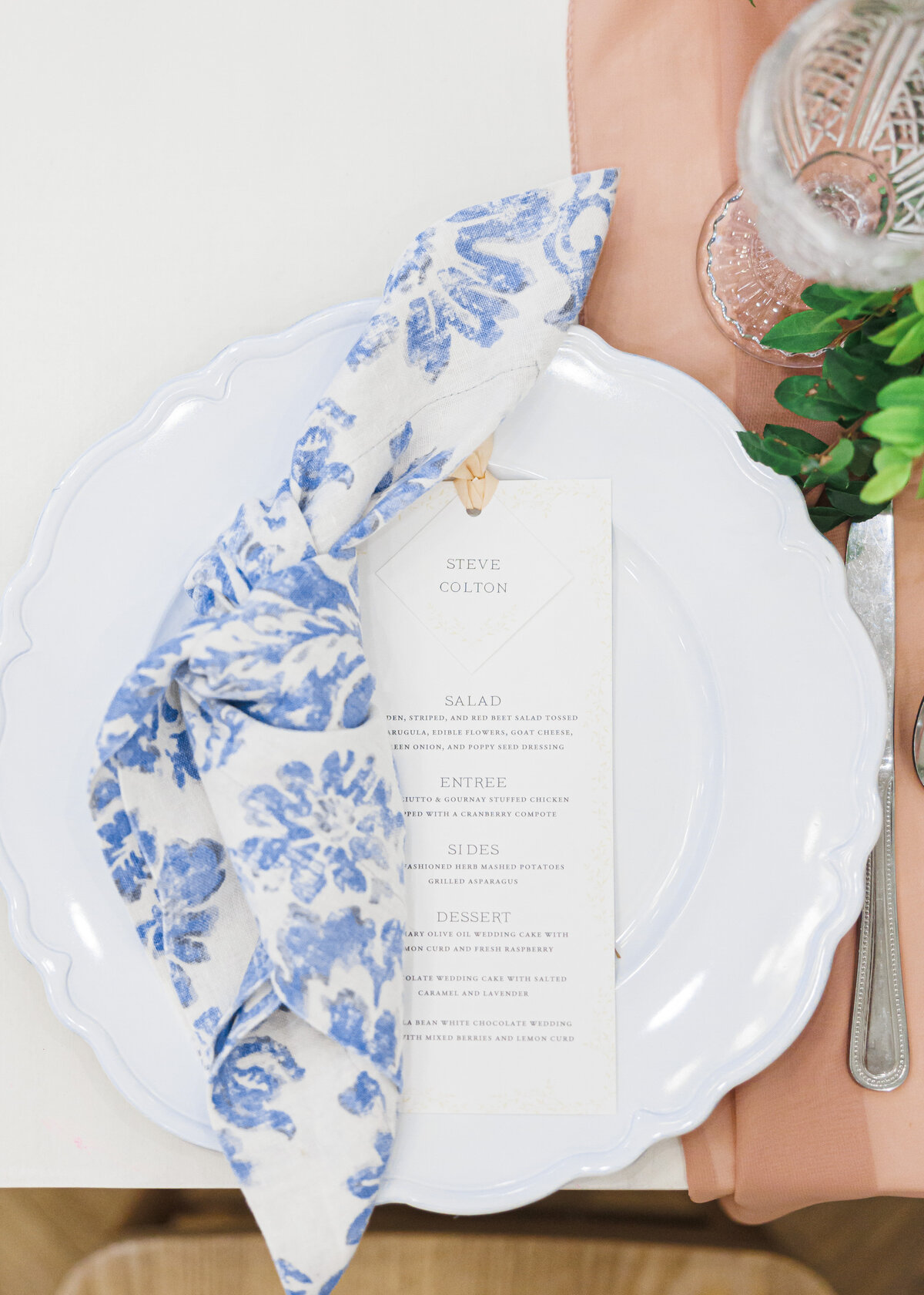 Custom blue floral napkins with scalloped plates for a wedding reception at Twenty and Creek 