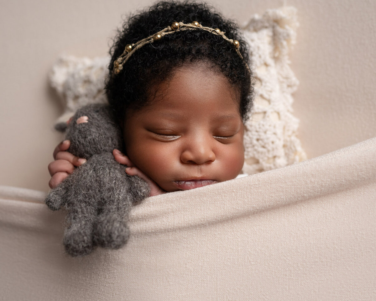 Newborn baby girl white headband Round Rock professional photographer