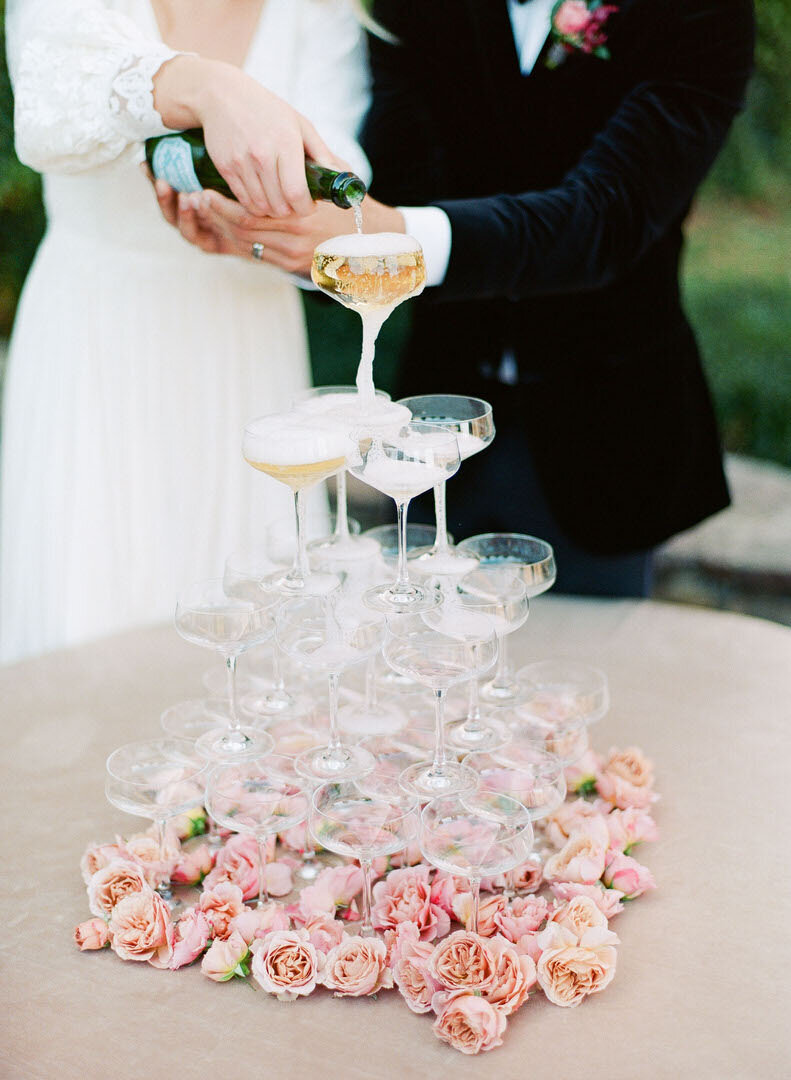 Couple Pouring Champagne Photo