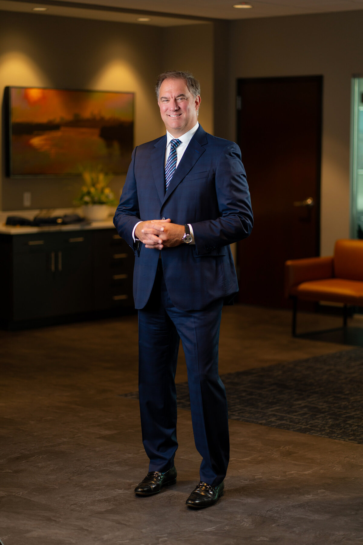 kansas-city-headshot_enviromental-portrait-photography-0109-man-in-navy-suit-in-office-headshot