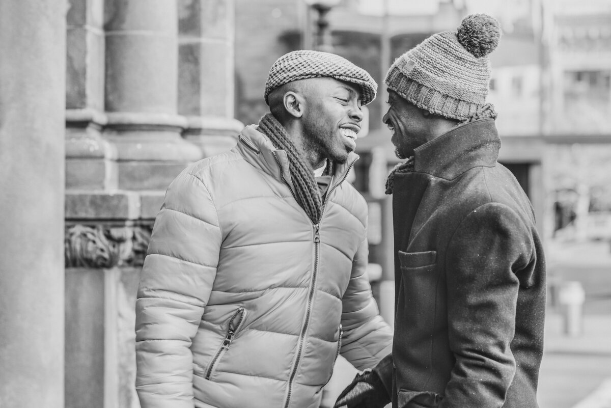 A couple in winter jackets about to kiss