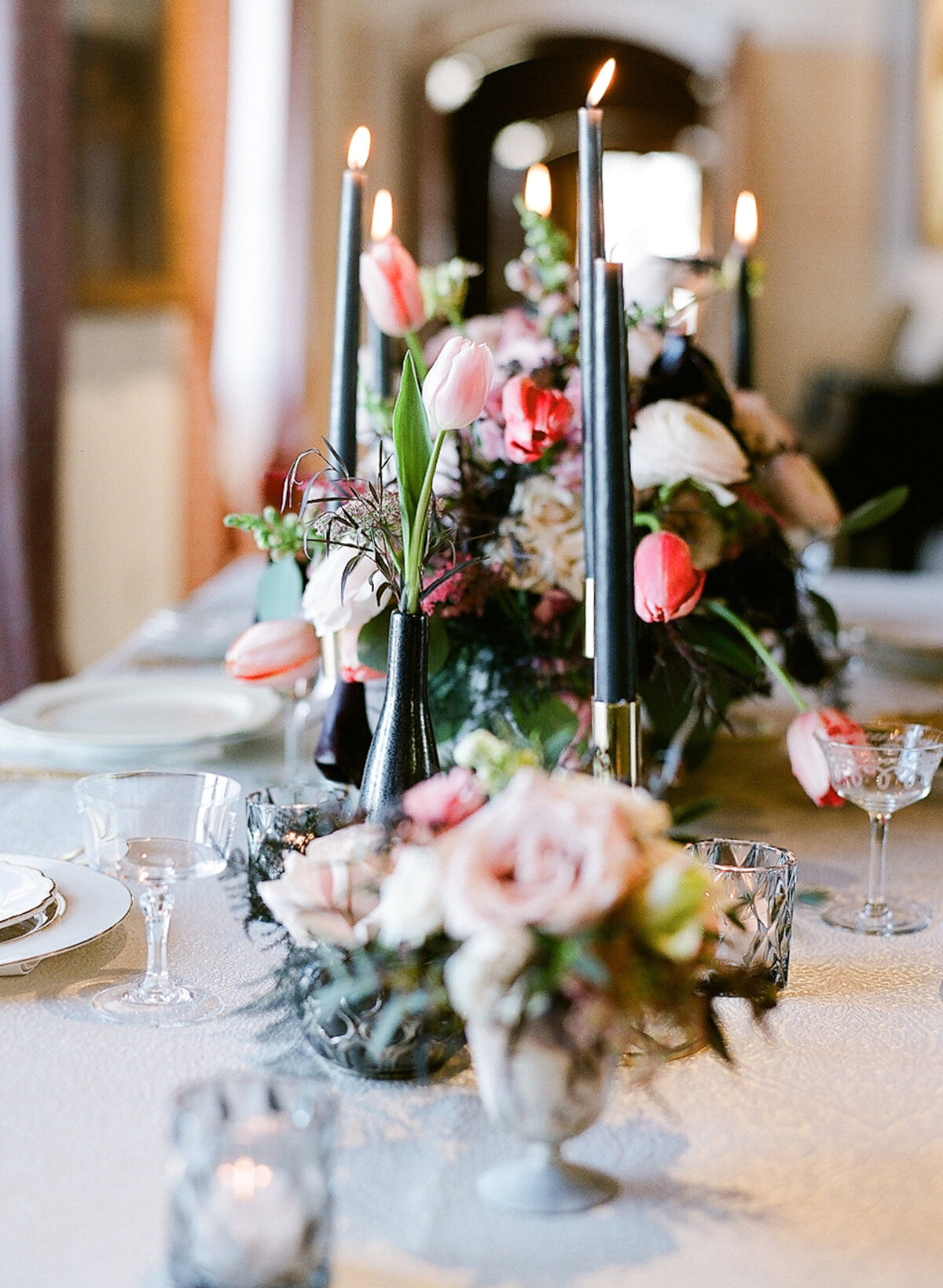 Pink, cream and maroon wedding centerpiece and candles