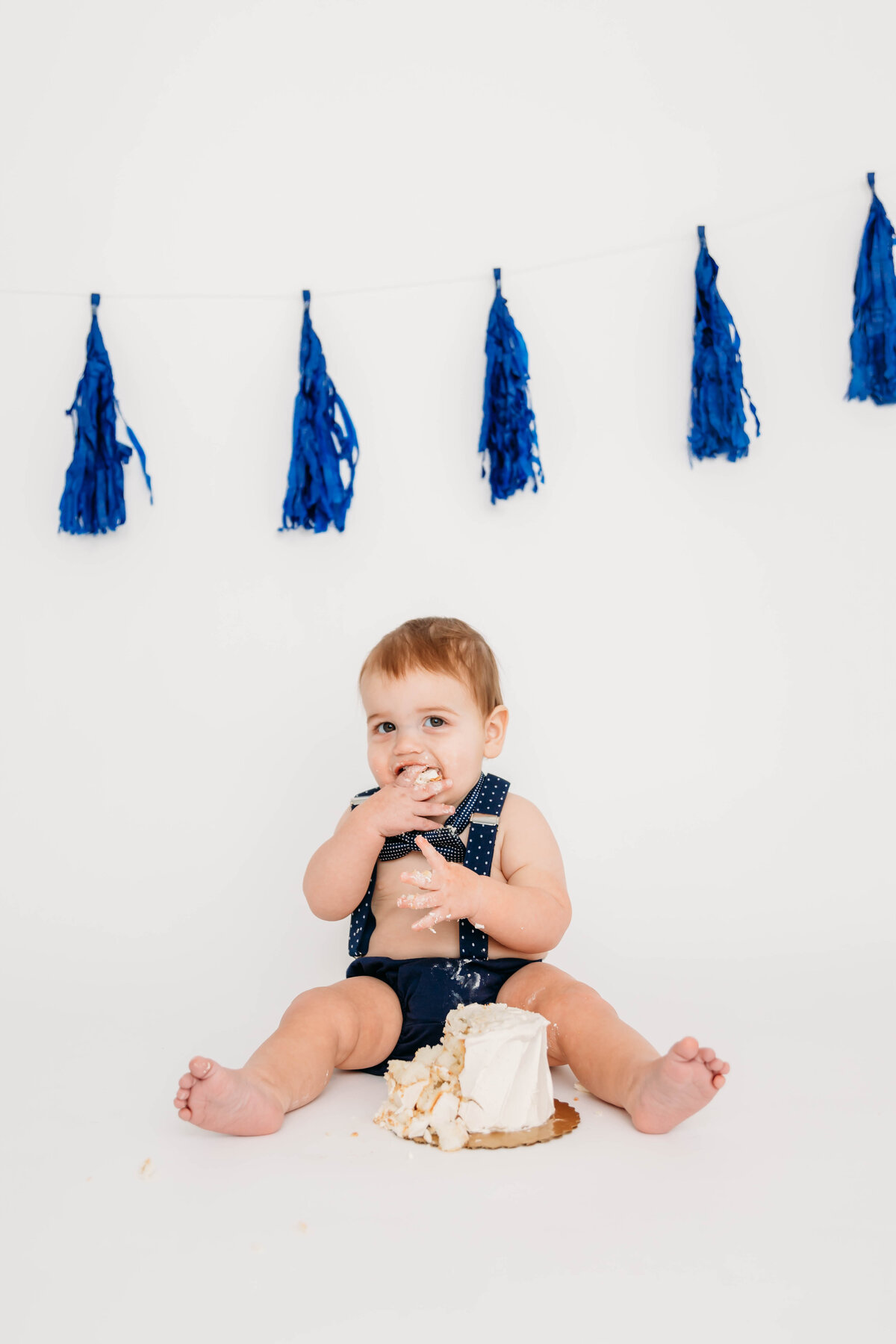 baby boy first birthday session on white backdrop by harrisburg pa baby photographer
