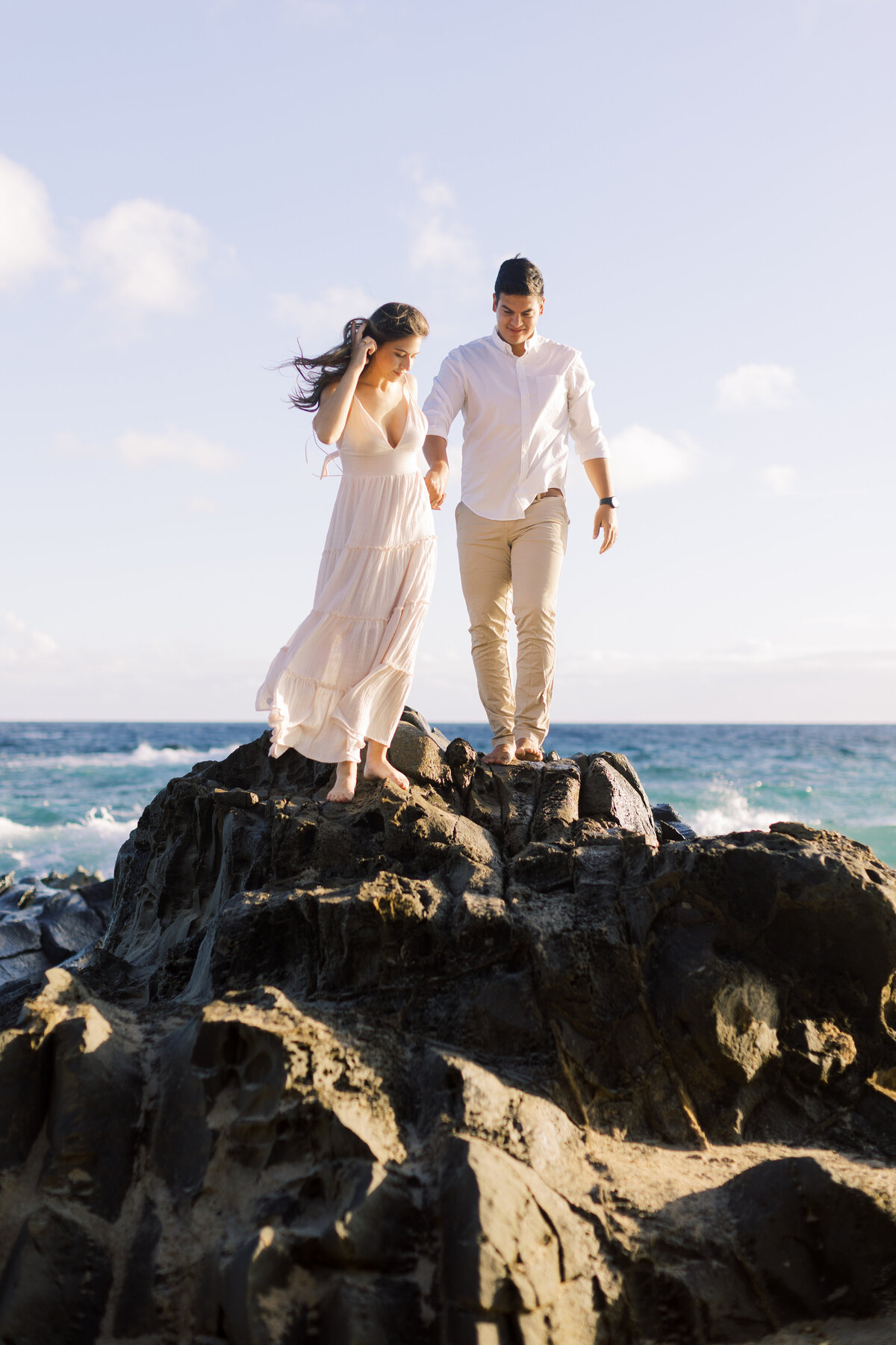 couple-on-black-rocks-in-hawaii