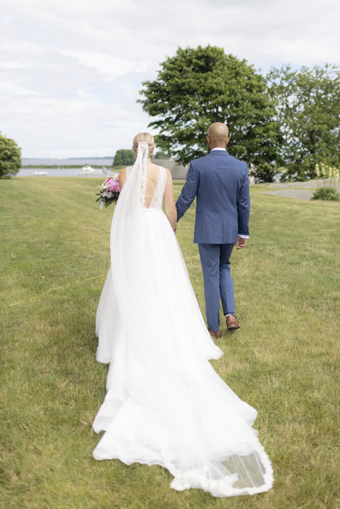 bride and groom walking together - gold shoes and wedding details - branford house wedding