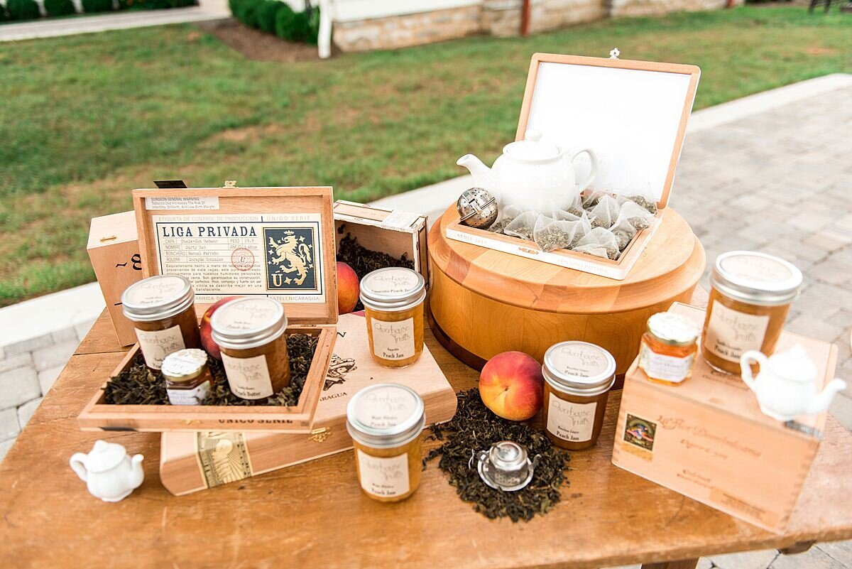 Southern peach jam and loose leaf tea wedding favor display table at Ravenswood Mansion