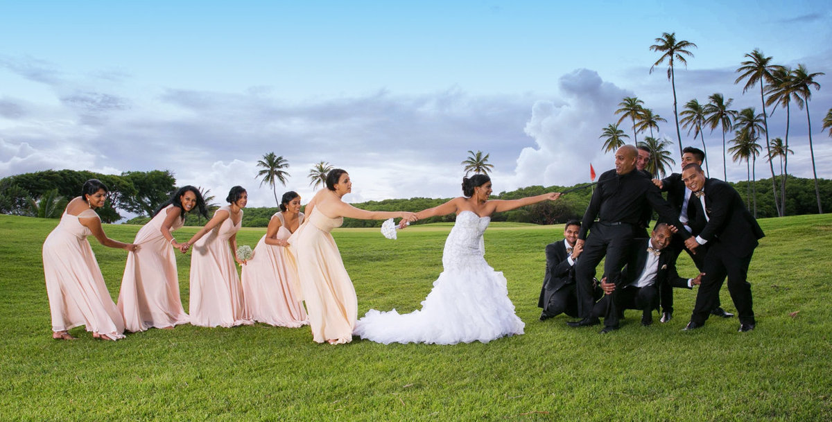 Fun, posed image of entire wedding party. Photo by Ross Photography, Trinidad, W.I..
