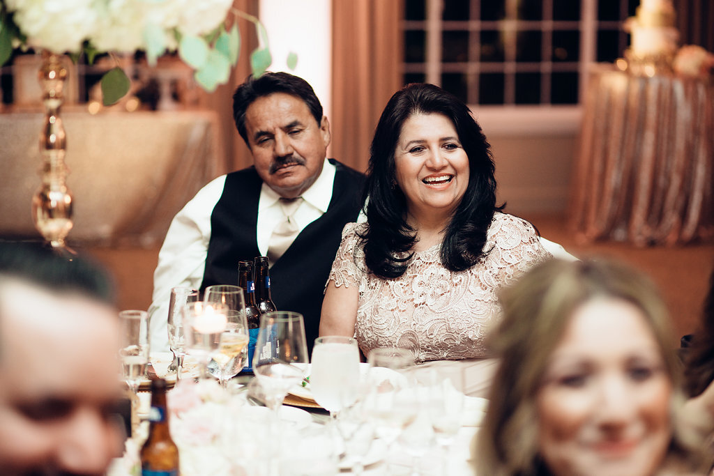 Wedding Photograph Of Man In Black Suit Sitting Beside a Woman In Light Brown Suit Los Angeles