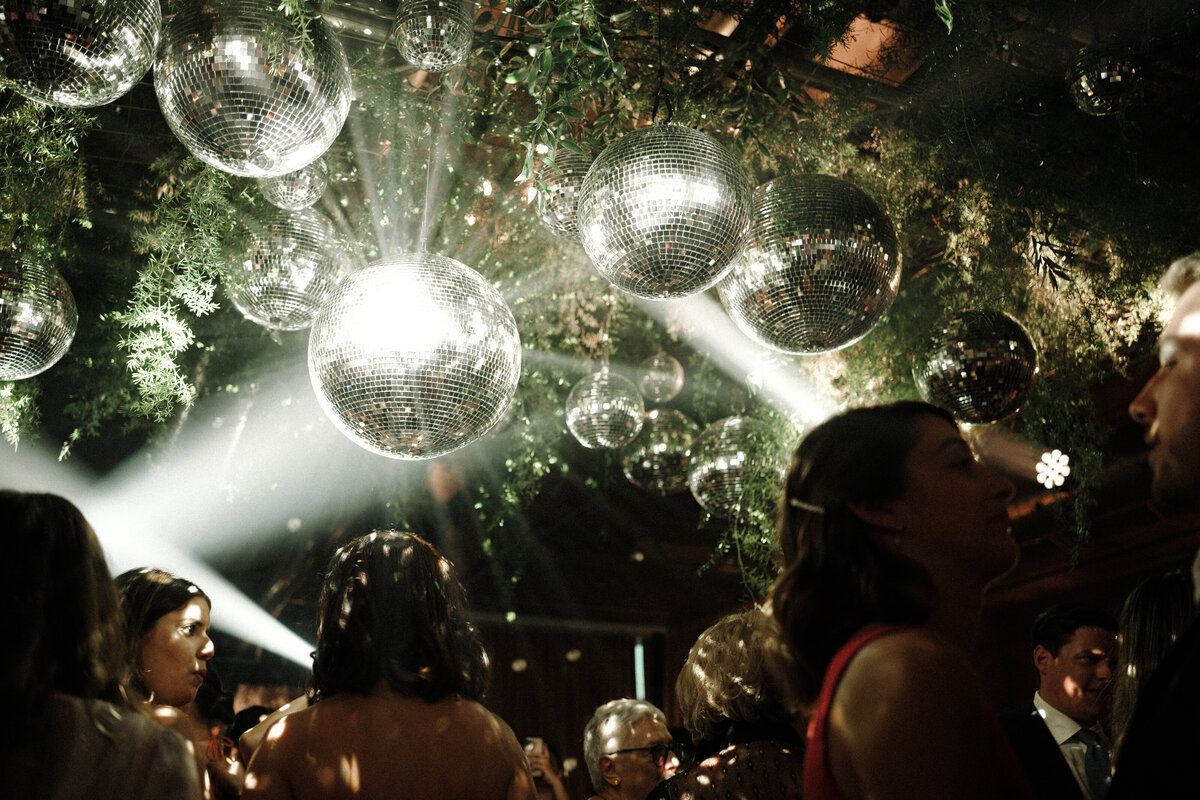disco balls and spotslights in the ceiling florals during the party