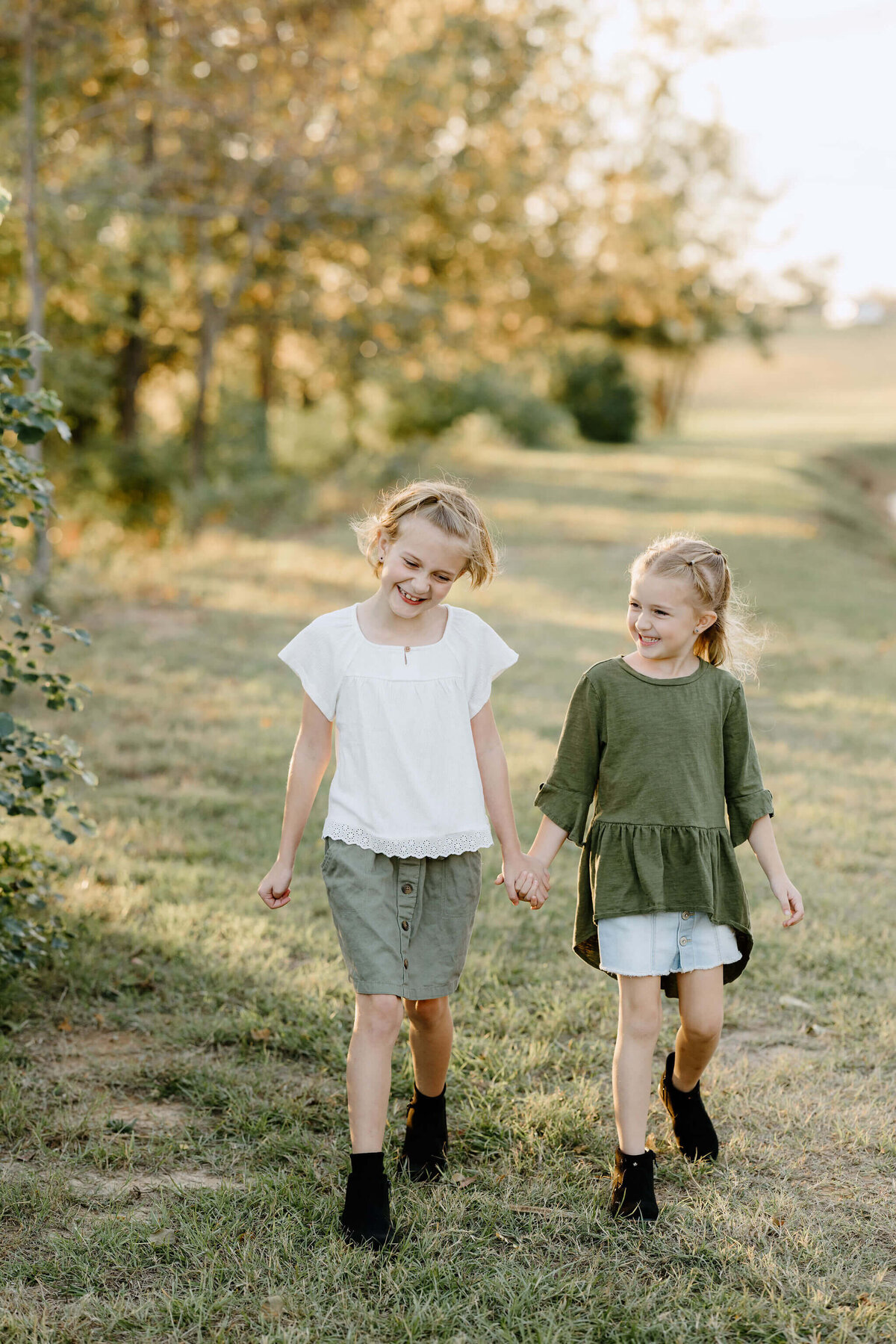 candid moment between 2 sisters during fall family pictures