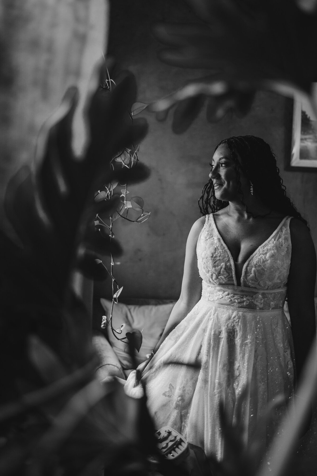 A person in a wedding dress looking off to the side 