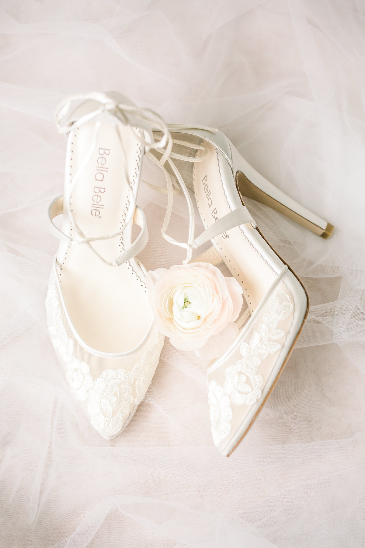 Bridal shoes and floral arrangement at Lowndes Grove by Karen Schanely.