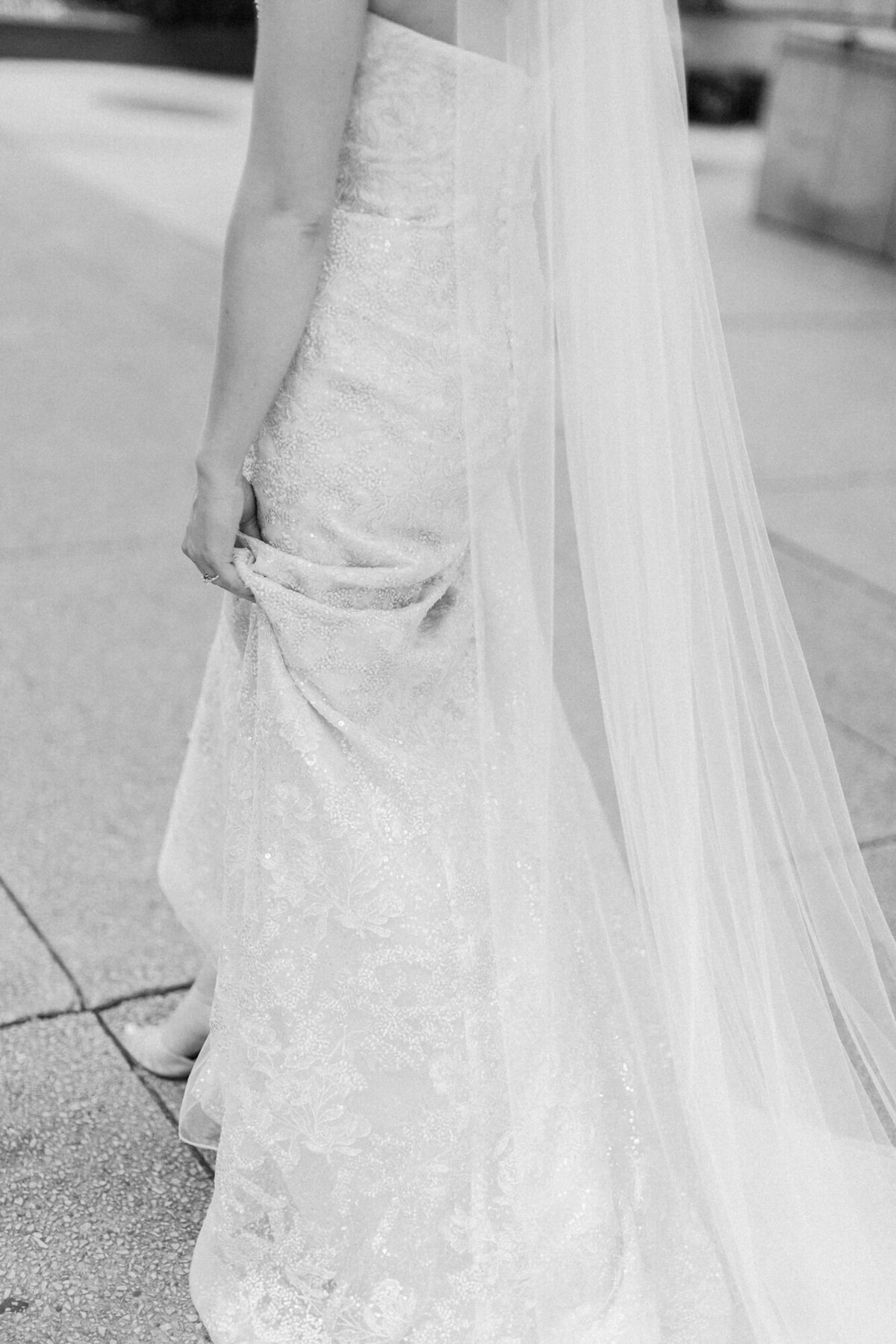 A detail shot of a bride's sparkly gown and wedding shoes