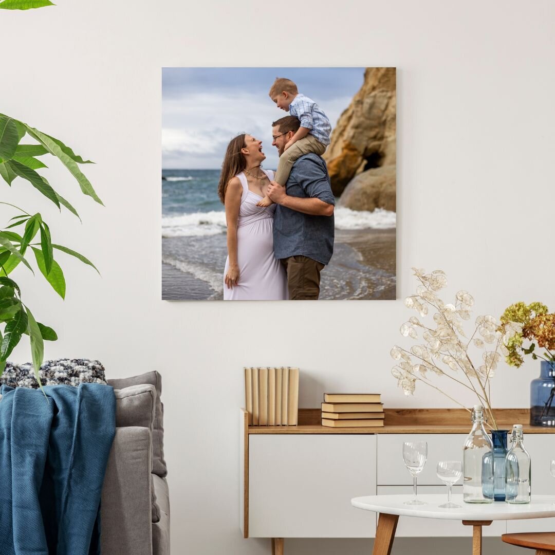 Large canvas featuring pregnant family at the beach.