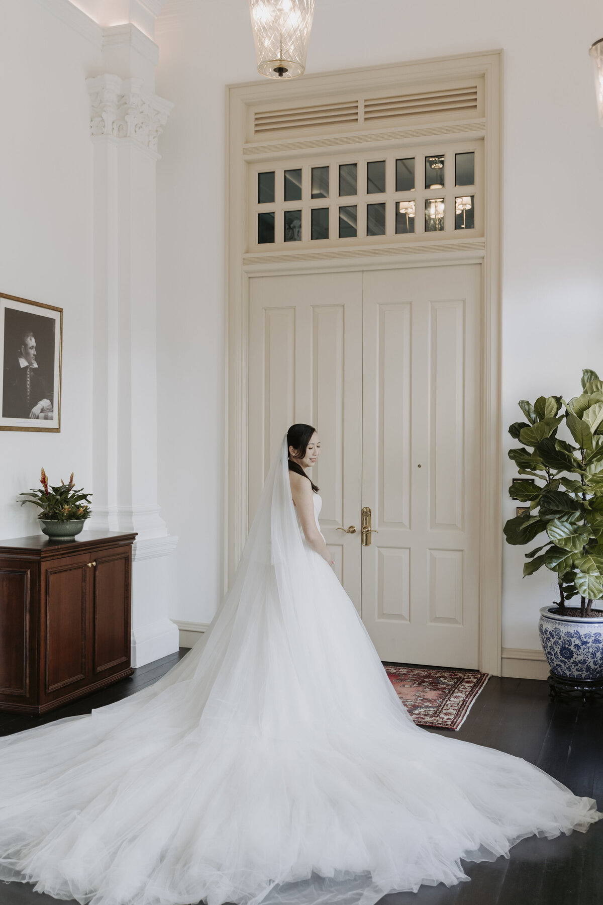 bride wearing a white long wedding gown at the Raffles Hotel