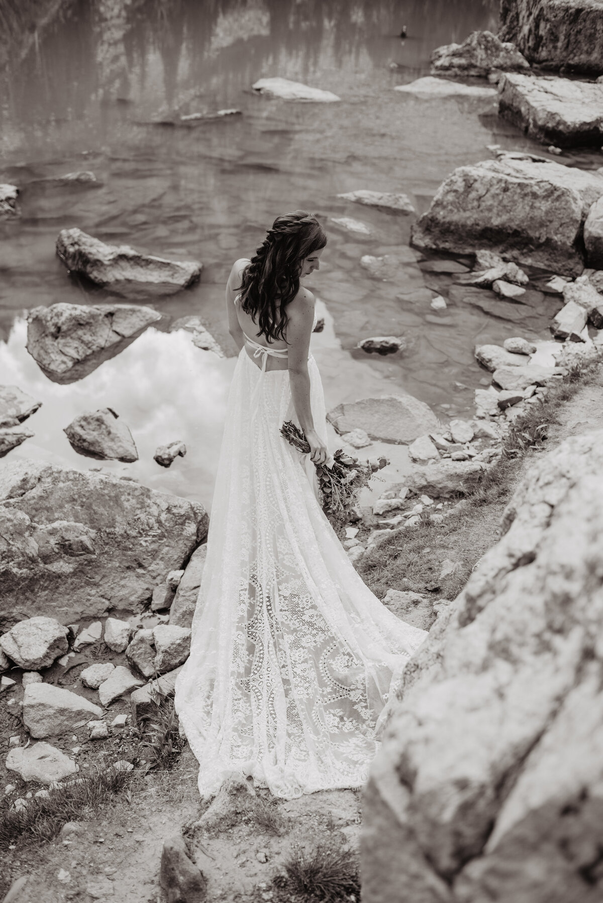 Jackson Hole Photographers capture bride with back to camera in black and white portrait