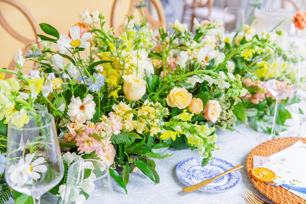 large floral centerpiece of bright spring colors at william aiken house