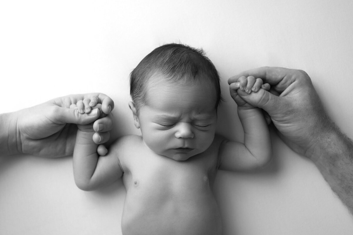 Black white newborn sleeping pose Georgetown professional baby photographer
