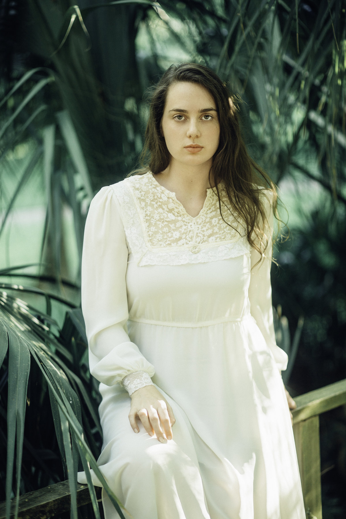Portrait Photo Of Young Woman In White Dress Leaning Los Angeles