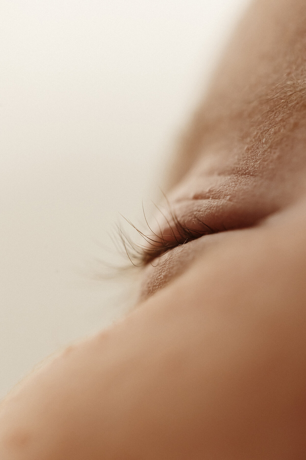 A close up of a newborn babies eyelash taken during a newborn photoshoot in lucy janes christchurch photography studio