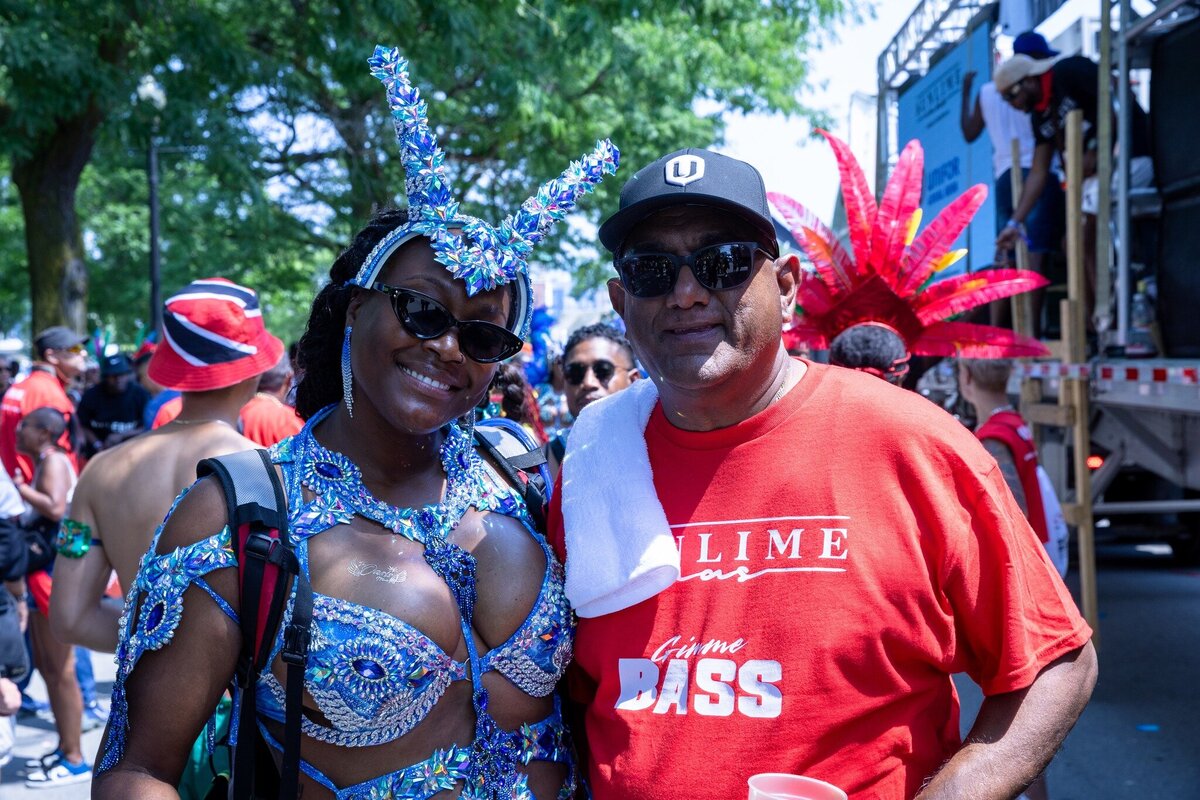 Toronto caribbean carnival parade masquerader in costume with Sunlime Mas, the number 1 medium size band at Toronto Carnival.