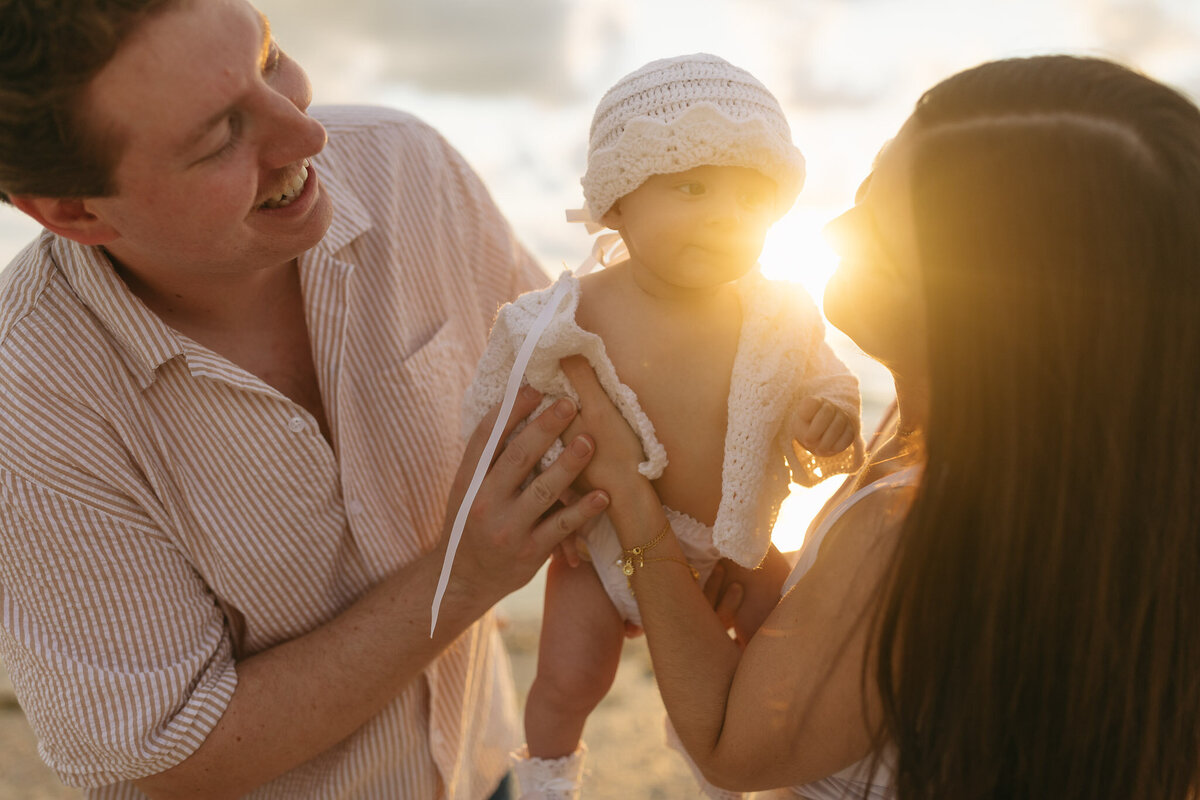 Golden hour beach photos with baby