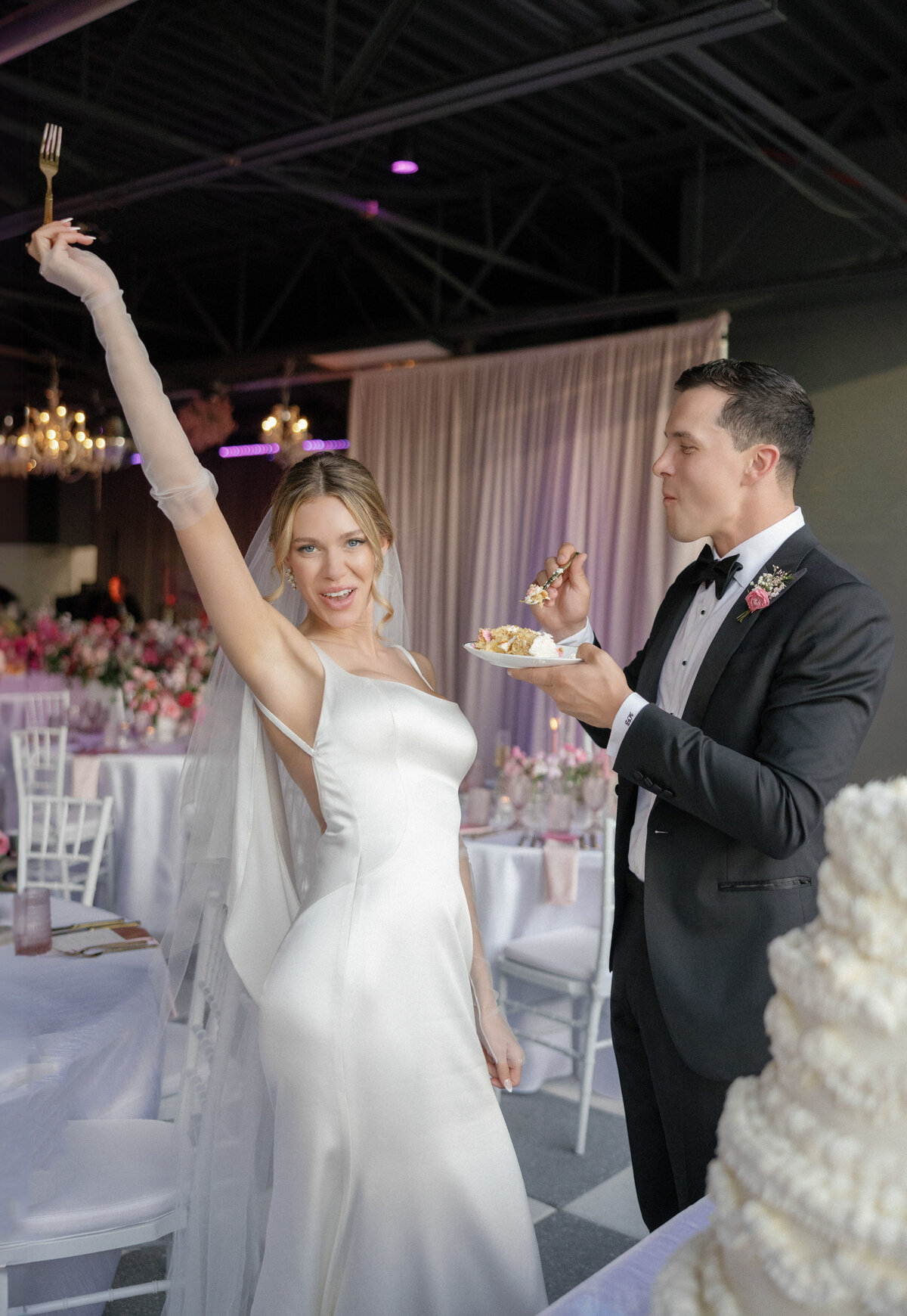 bride and groom eating wedding cake