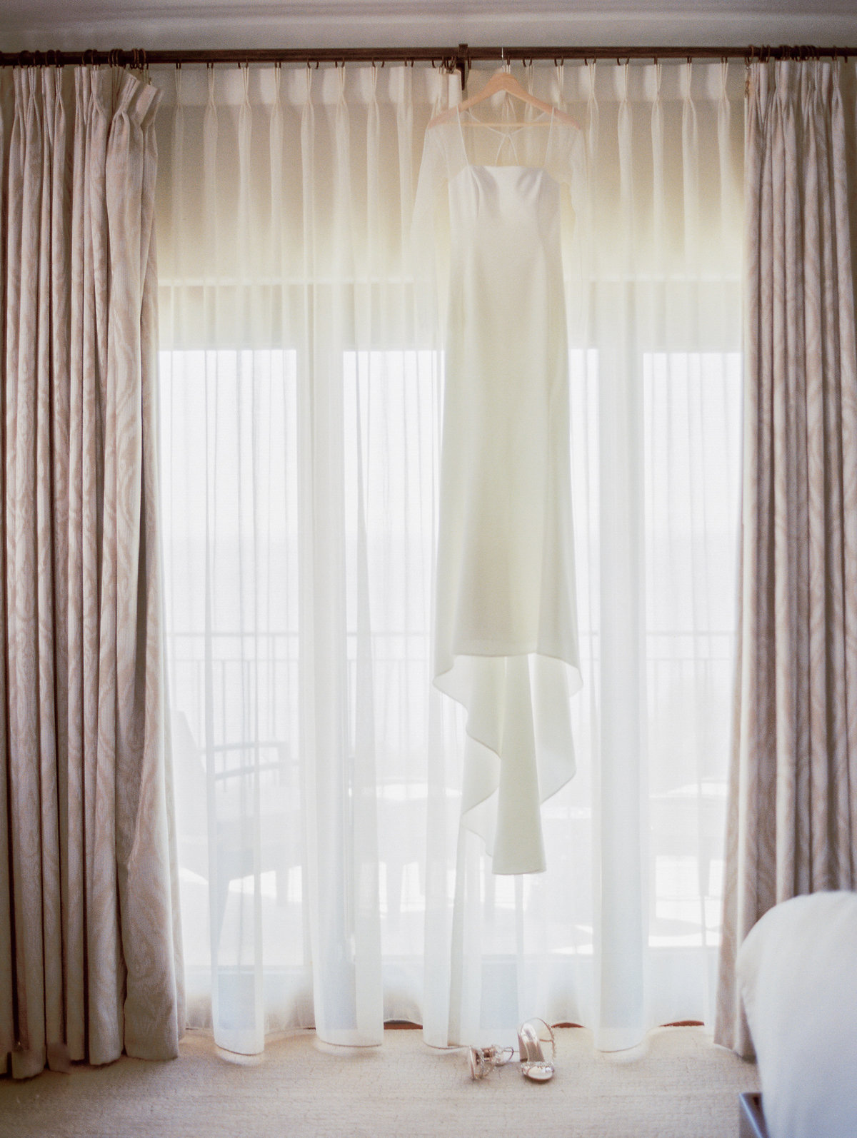 white bridal gown hanging at the ritz bacara in santa barbara