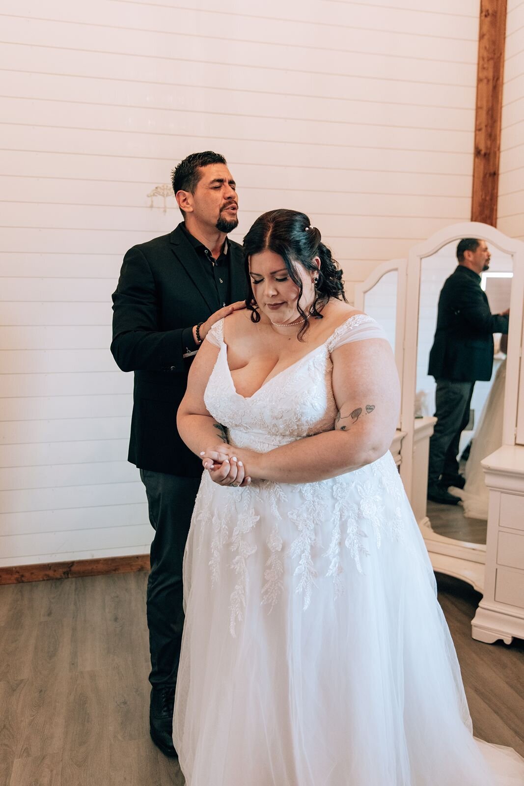 pastor prays with the bride before the wedding ceremony