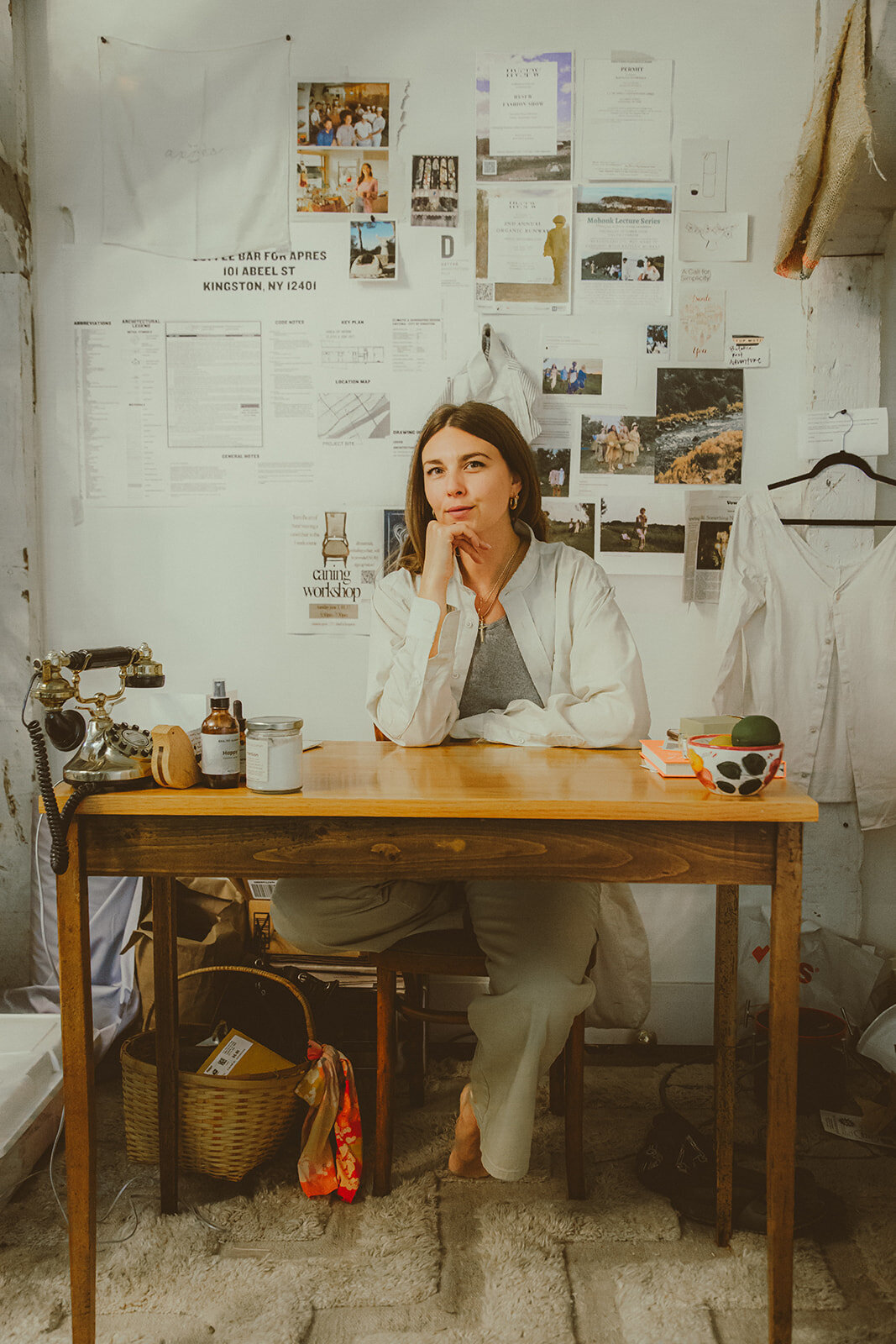 portrait of a clothing designer sitting at her desk