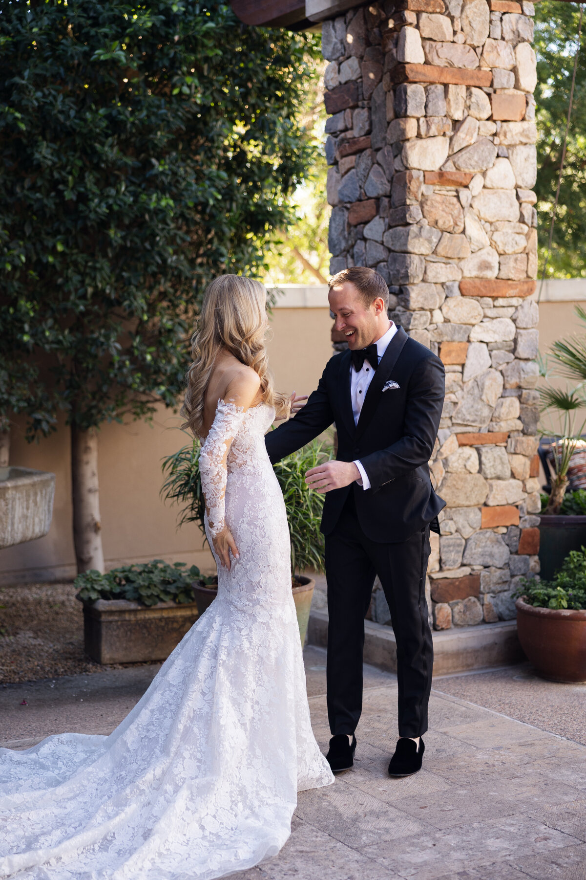Bride and groom sharing a first look moment on wedding day at Paradise Valley Country Club in Arizona