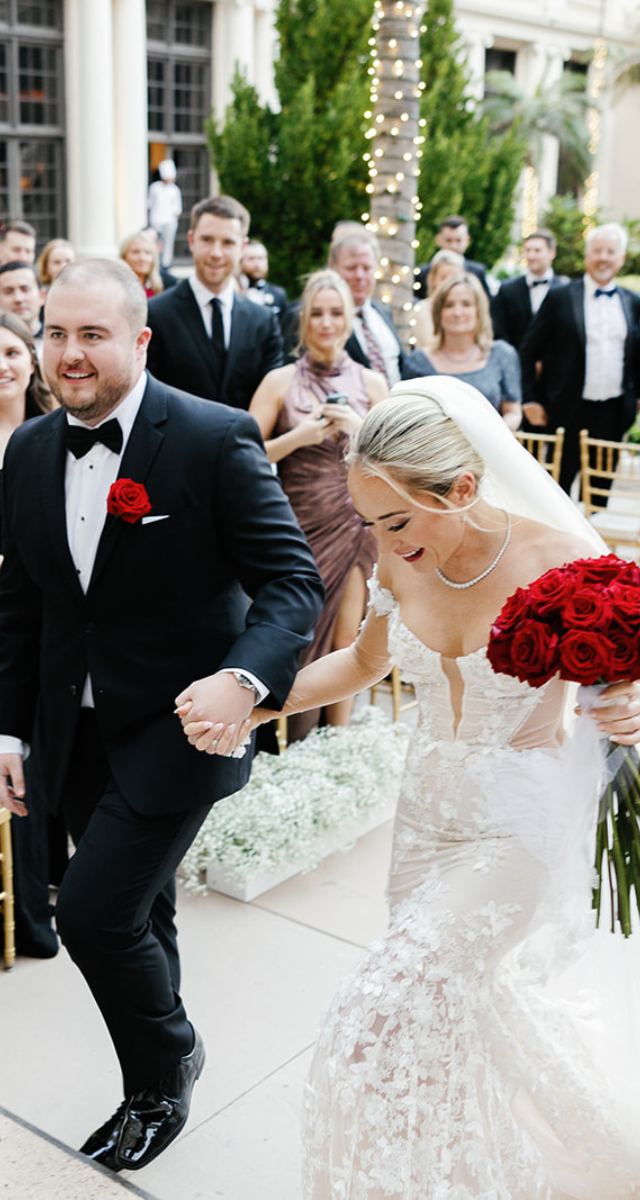 Stunning bridal procession at The Breakers, showcasing vibrant florals and joyful moments, captured by Miami wedding photographer Claudia Amalia.