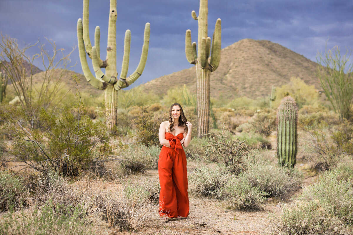 college senior girl posing in the desert