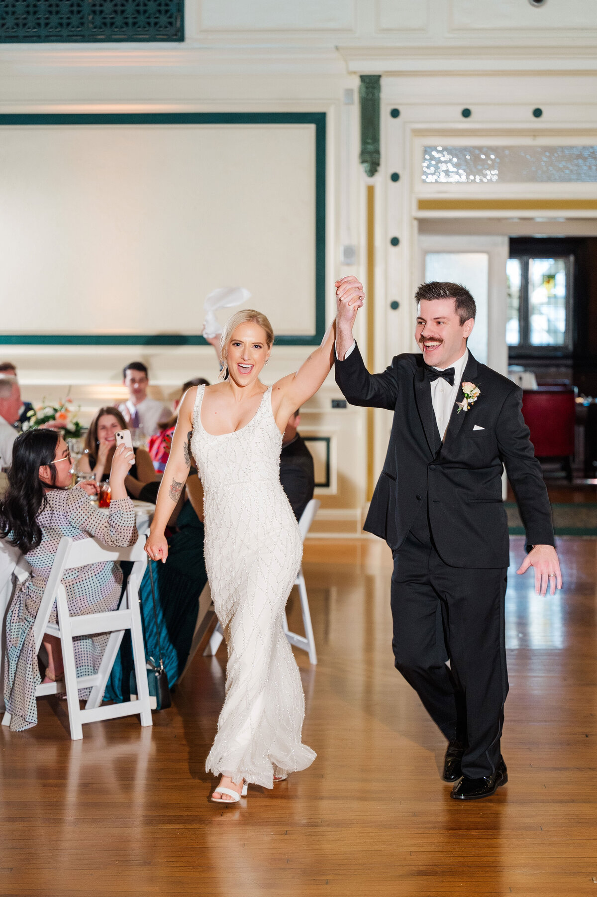 bride and groom being introduced into wedding reception at oakland pittsburgh venue soldiers and sailors
