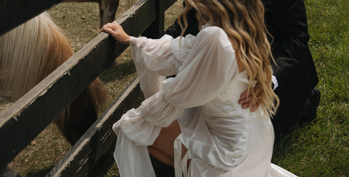 Rustic Charm: Engagement Session with Horses and a Flowing Dress in the Southern Countryside