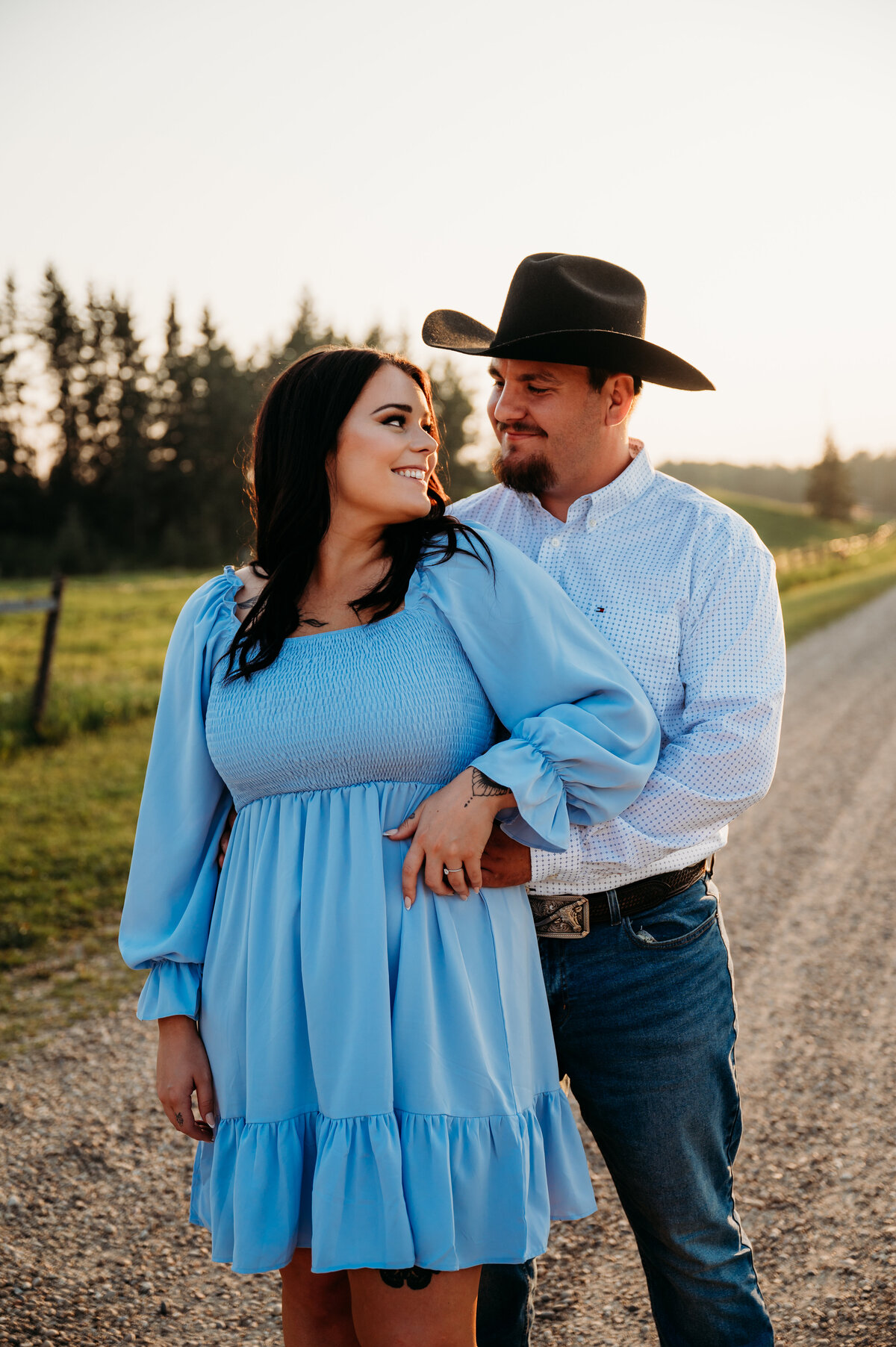 cowboy looks into his partners eyes with love
