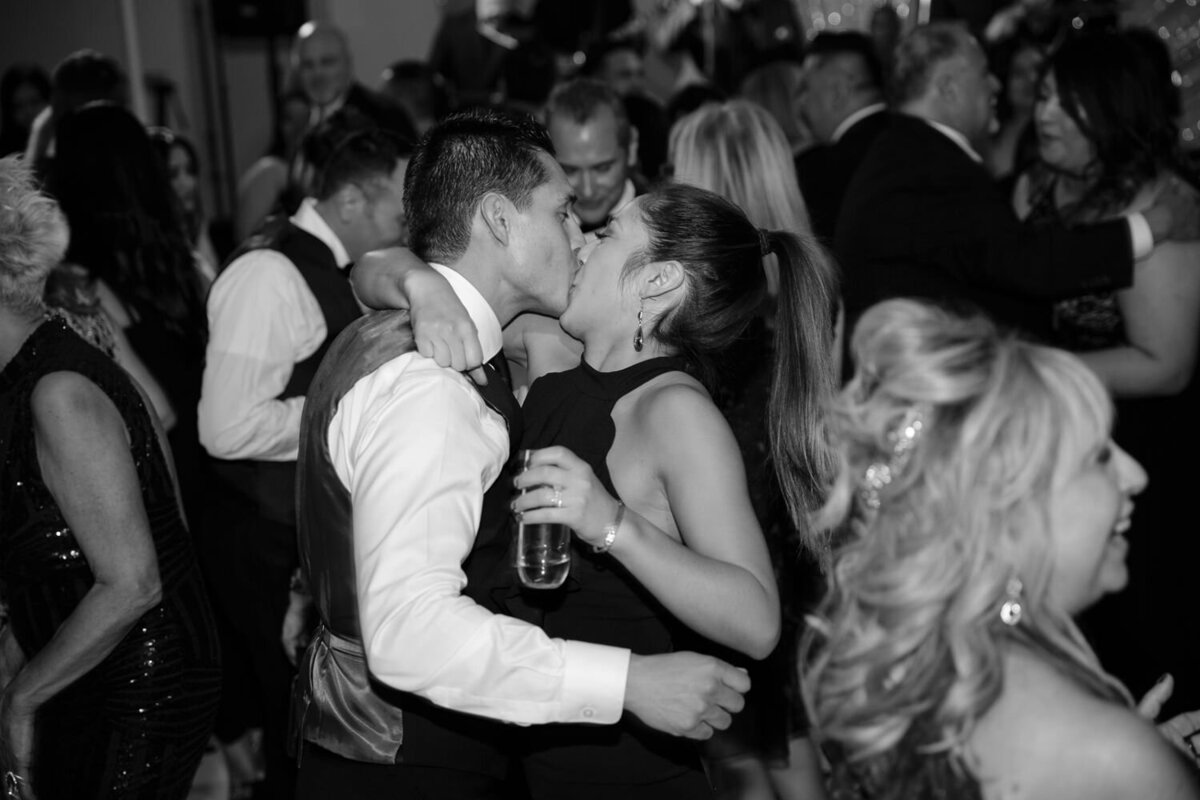 A couple kissing on a dance floor