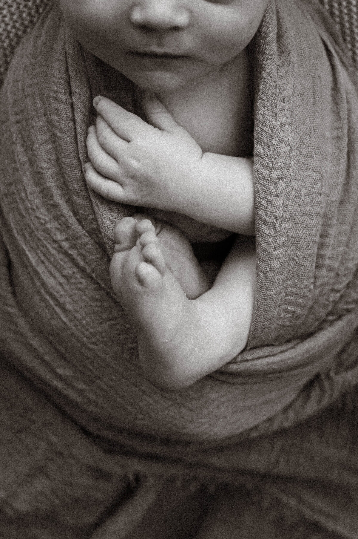 Newborn baby swaddled at an in home session in Busselton captured by south west and Perth photographer Kalie Creative
