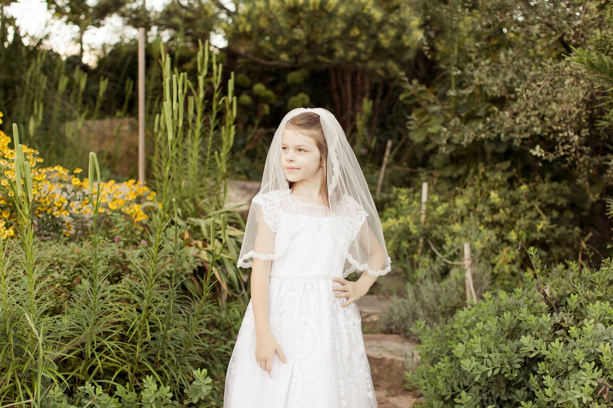 girl in a white dress in a garden