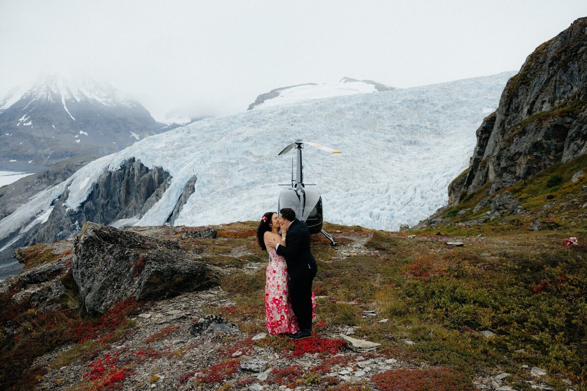 Newlyweds enjoying a helicopter ride to their elopement spot.