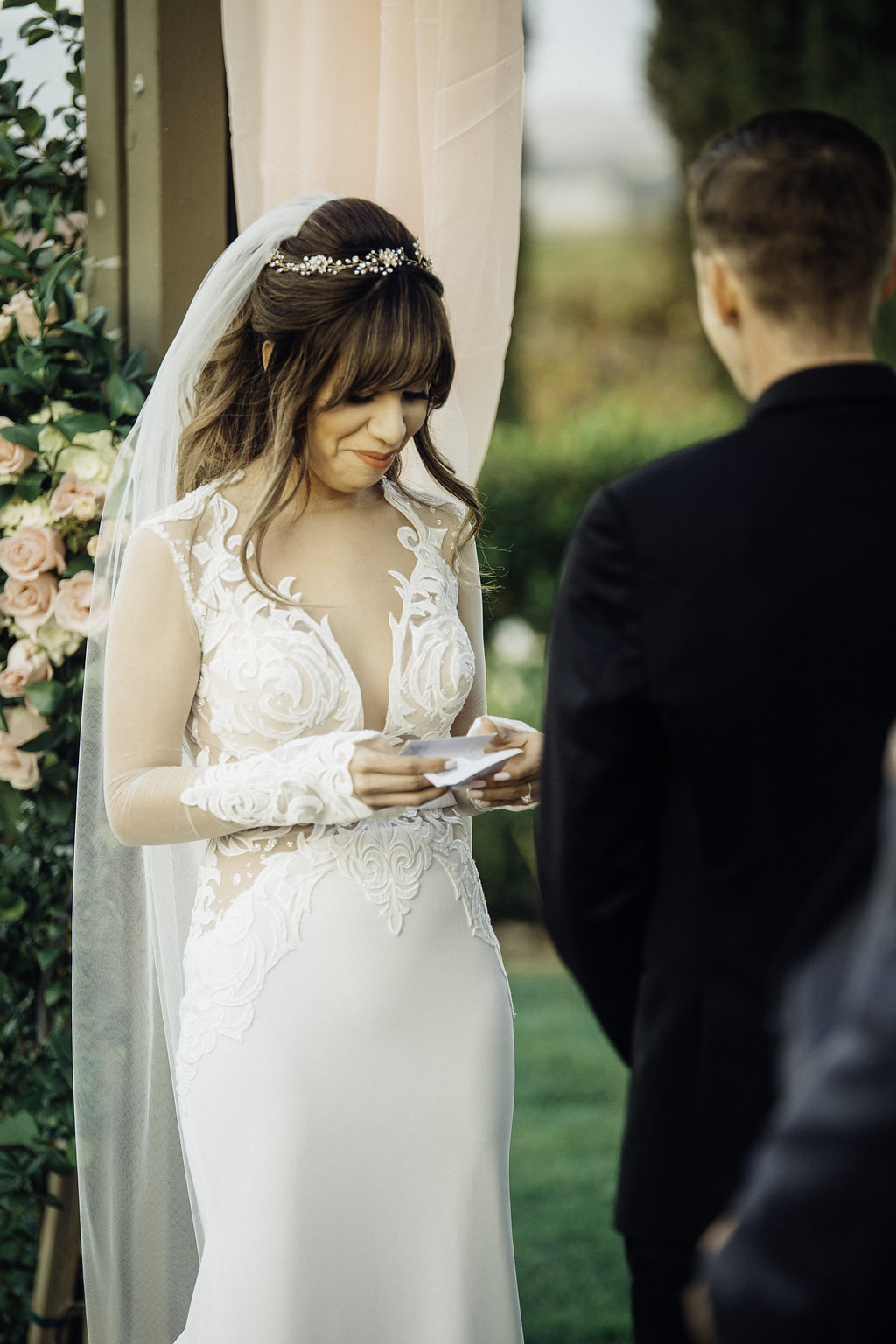 Wedding Photograph Of Bride Staring Down at a Piece of Paper Los Angeles